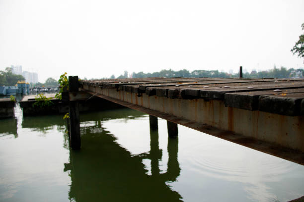 istock wooden pontoon stretch into the water. 868515202