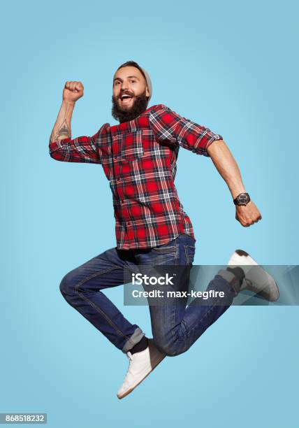 Cheerful Bearded Man Jumping Stock Photo - Download Image Now - Men, Cool Attitude, Flying