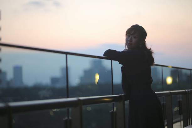 istock Beautiful woman enjoying sunset view 868518644