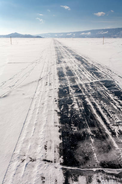 istock Ice road on the Baikal lake 868518782