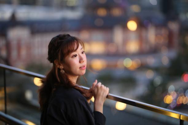 istock Young woman at terrace 868519374