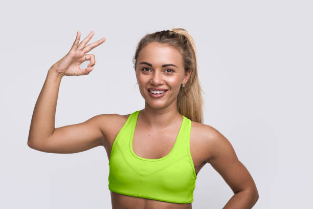 istock Cheerful sportswoman gesturing at camera 868522344
