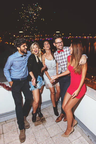 istock Group of people having a party on the roof 868523622