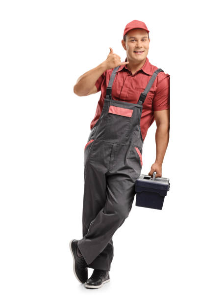 istock Repairman with a toolbox making a call me sign and leaning against a wall 868523658