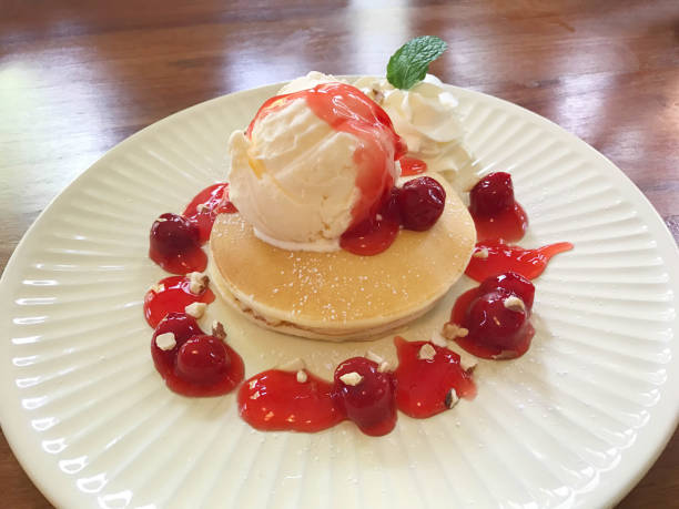 istock Pancake with vanilla ice cream and cherry sauce 868523812