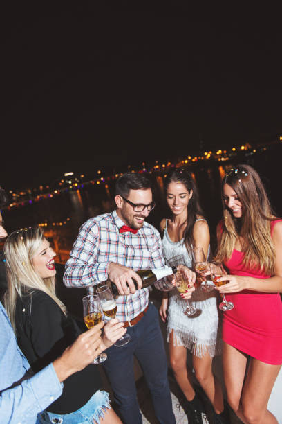 istock Group of people having a party on the roof 868526646
