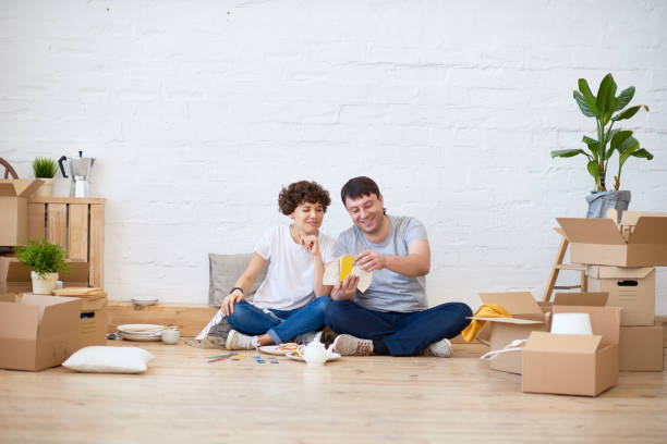 istock Cheerful couple thinking of home decor 868526776