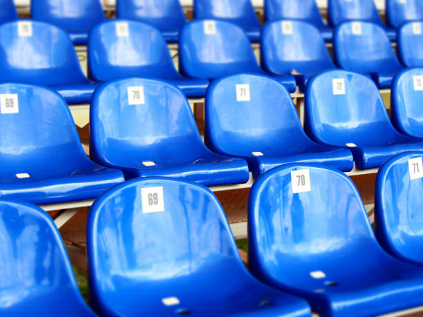 istock Blue plastic armchairs on stadium, bleachers 868532472
