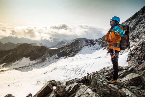 istock Climber enjoying a view from the mountain top 868536572