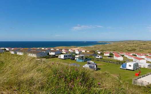 St Ives Bay Cornwall with static caravans and camping in summer with beautiful blue sky