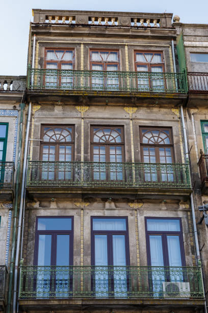 istock Typical Antique Portuguese Architecture: Grey Facade with Old Wi 868546786