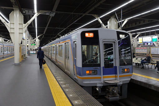 Osaka, Japan - November 15, 2016: People at Namba Station in Osaka, Japan. This train is operated by Nankai Electric Railway going to Wakayamako.