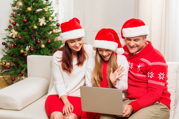istock family making video call on christmas 868549282