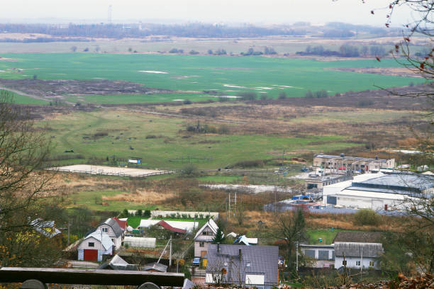 istock View of old green meadows and a cottage settlement 868554364