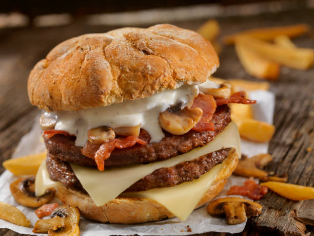 Mushroom, Bacon, Swiss Burger with Blue Cheese Dressing Mushroom, Bacon, Swiss Burger with Fries bacon cheeseburger stock pictures, royalty-free photos & images