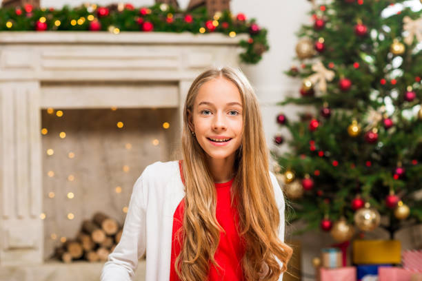 istock girl in christmas decorated room 868558078