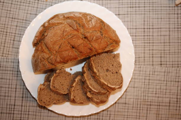 istock Some pieces of round bread and a half-loaf on the place. 868558582