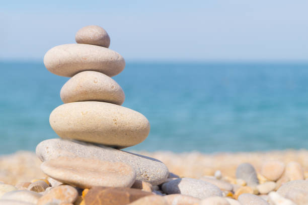 istock Pebble tower standing on the left on the sea beach 868558908