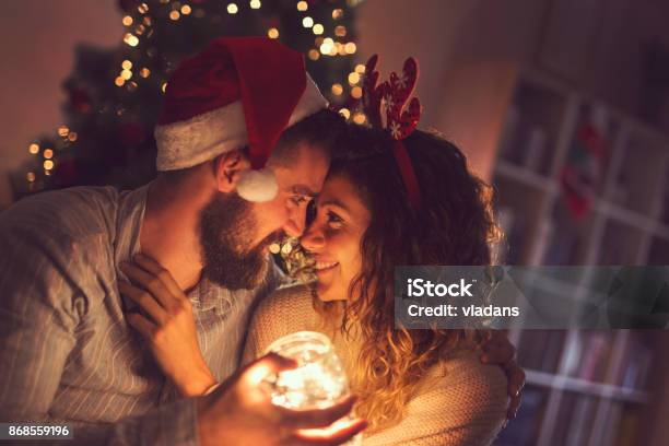 Christmas Romance Stock Photo - Download Image Now - Christmas, Couple - Relationship, Dating