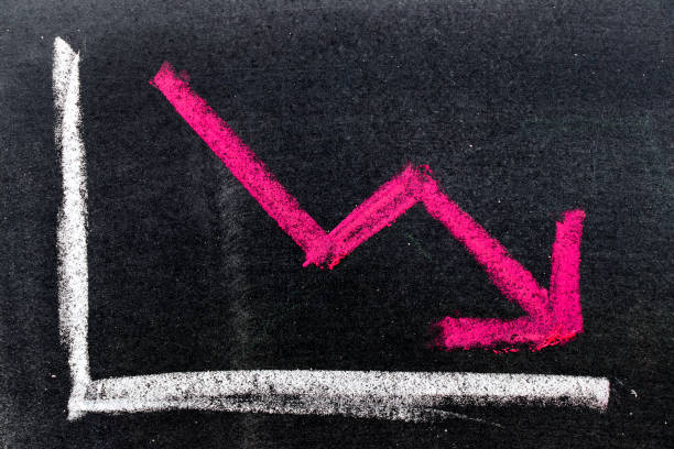 istock Red color hand drawing chalk in arrow down shape on black board background (Concept of stock decline, down trend of business, economy) 868559680