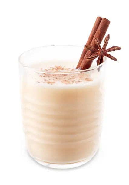 eggnog in glass isolated on white background with clipping path. Christmas drink. Alcohol sweet cocktail. Traditional festive winter beverage