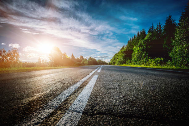 istock Sunrise beautiful road in forest 868568348