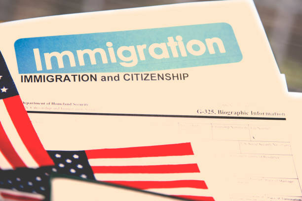 istock American immigration, citizenship forms with USA flag. 868575204