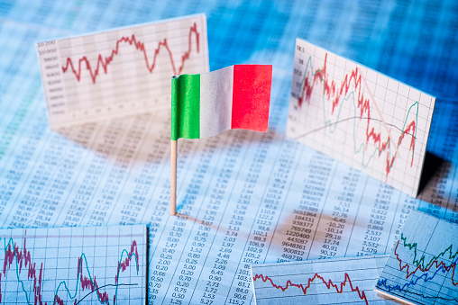 Italian flag with price tables and graphs on economic development.
