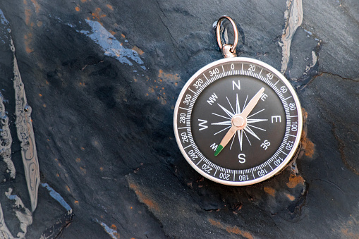 compass on stone board background. Using wallpaper or background travel or navigator image