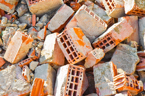 Concrete and brick rubble debris on construction site after a demolition of a brick building