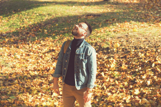 istock Modern guy enjoying in the park/nature. Autumn concept. 868584562