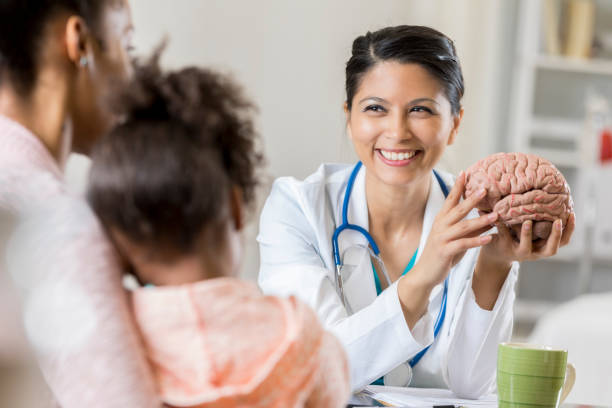 istock Female pediatrician uses visual aide during patient discussion 868595732