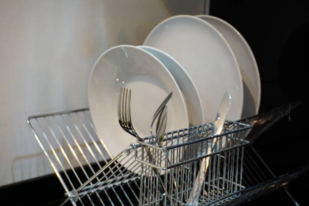 istock Pile of dirty dishes in the kitchen 868596892