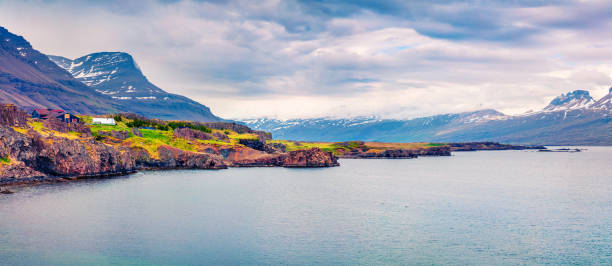 istock Typical Icelandic landscape with volcanic mountains and Atlantic ocean coast. 868603518