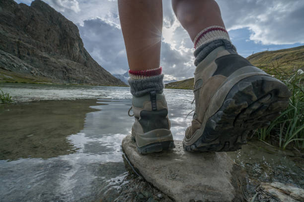 Young hiker in mountains, closeup. Fisheye lens effect