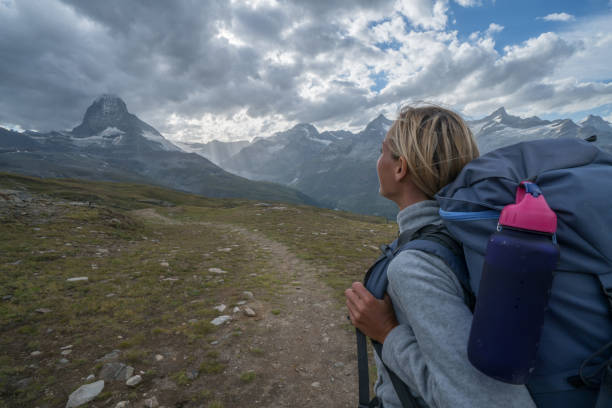 istock Hiking girl going towards Matterhorn, Switzerland 868603852