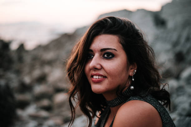 istock Beautiful woman by the ocean 868606850
