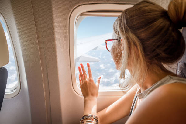 istock Woman in the airplane 868607430