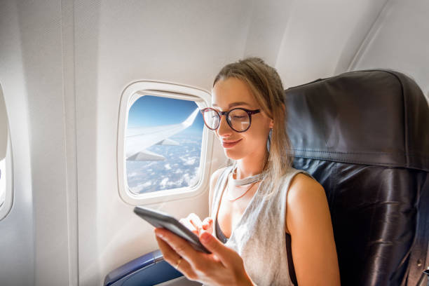 istock Woman in the airplane 868607476