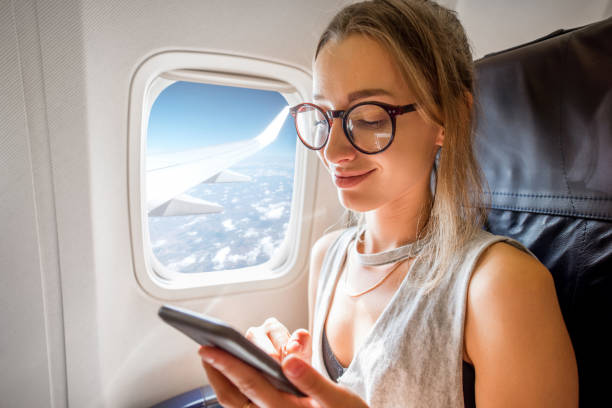 istock Woman in the airplane 868607544