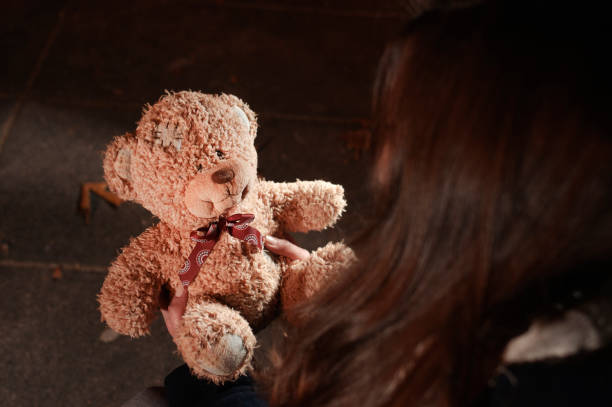 istock Teddy bear in the night park 868610066