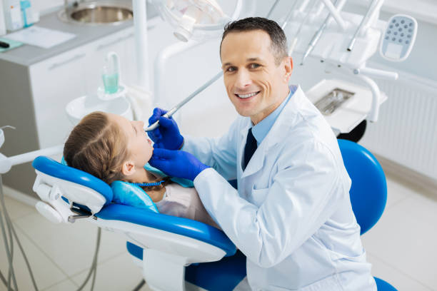 istock Delighted smart dentist looking at you 868611366
