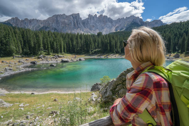 istock Hiker female at lake Carezza, Italy 868614826