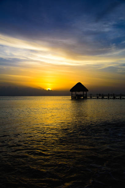 istock gazebo bridge Caribbean sea at sunset 868619836