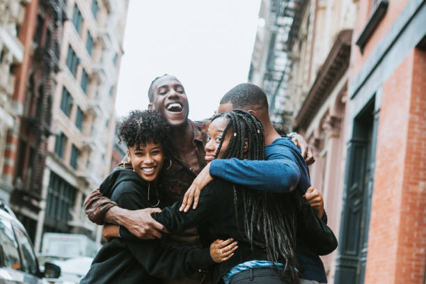 istock Friends Greeting Each Other in New York 868624282