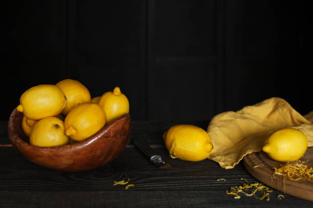 istock Frash lemons and lemon zest on the dark wooden table 868627708