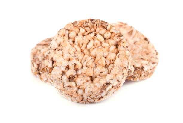 istock Stack of puffed whole grain crispbread isolated on white background 868631130