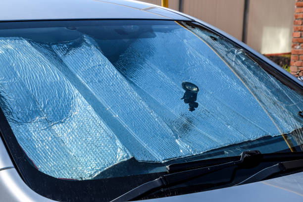 istock Protection of the car panel from direct sunlight. Sun Reflector windscreen 868631678
