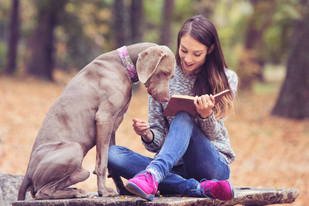 Girl with a dog in the park