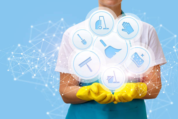 istock Worker shows icons of cleaning services . 868638366